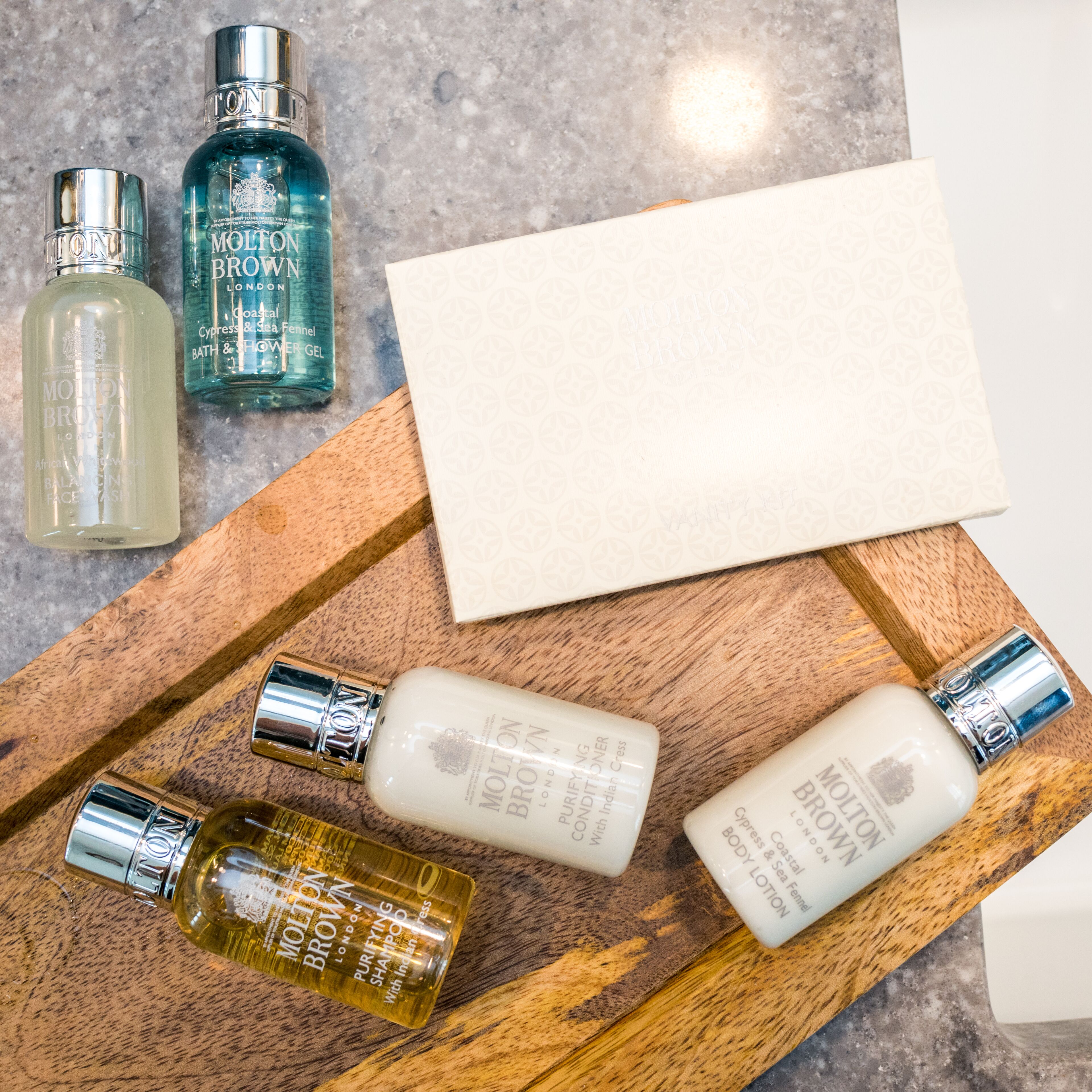 designer toiletries, hair dryer, dressing gowns, towels