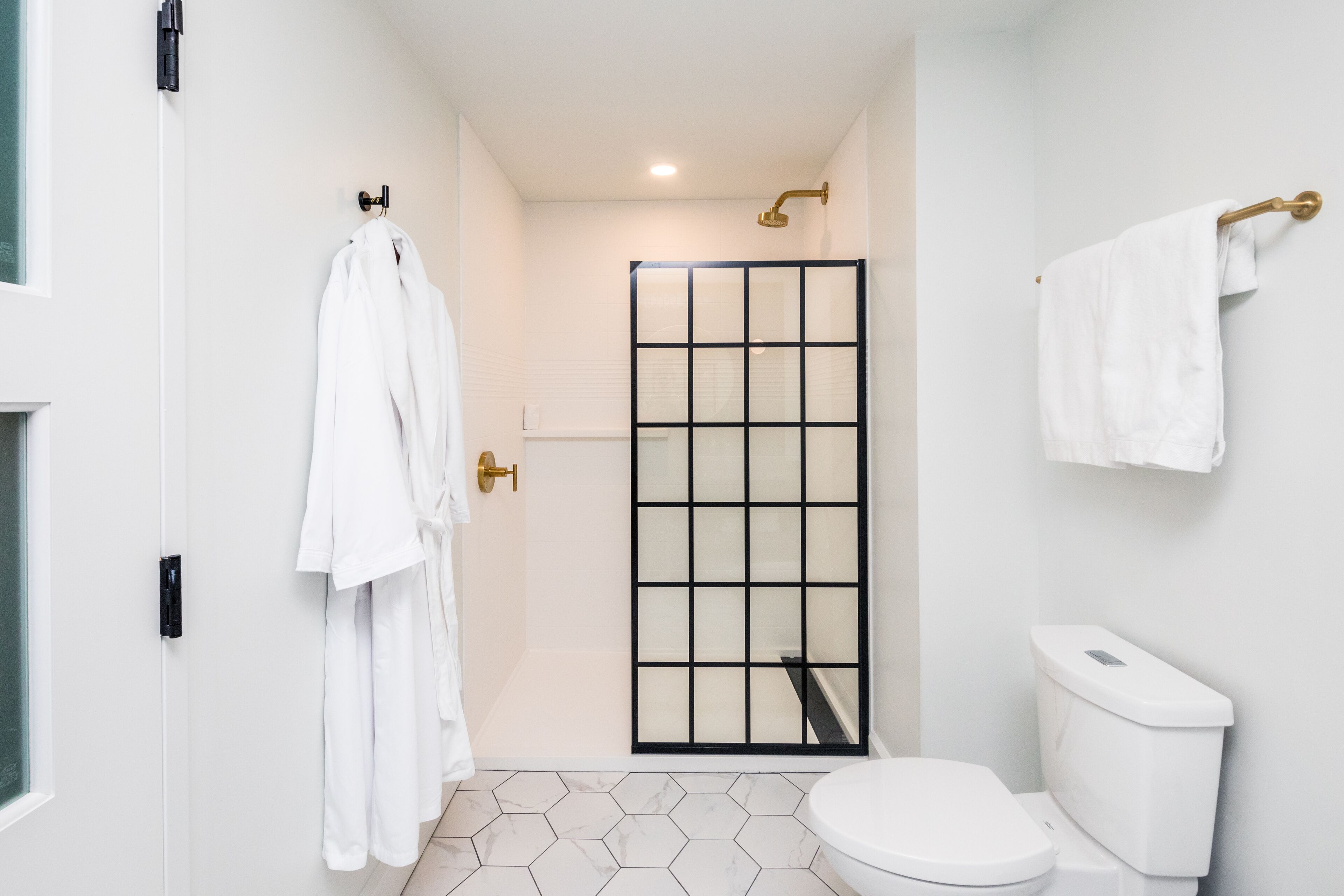 designer toiletries, hair dryer, dressing gowns, towels