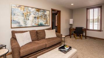 Executive Apartment | Living area | 55-inch Smart TV with cable channels, TV, iPad