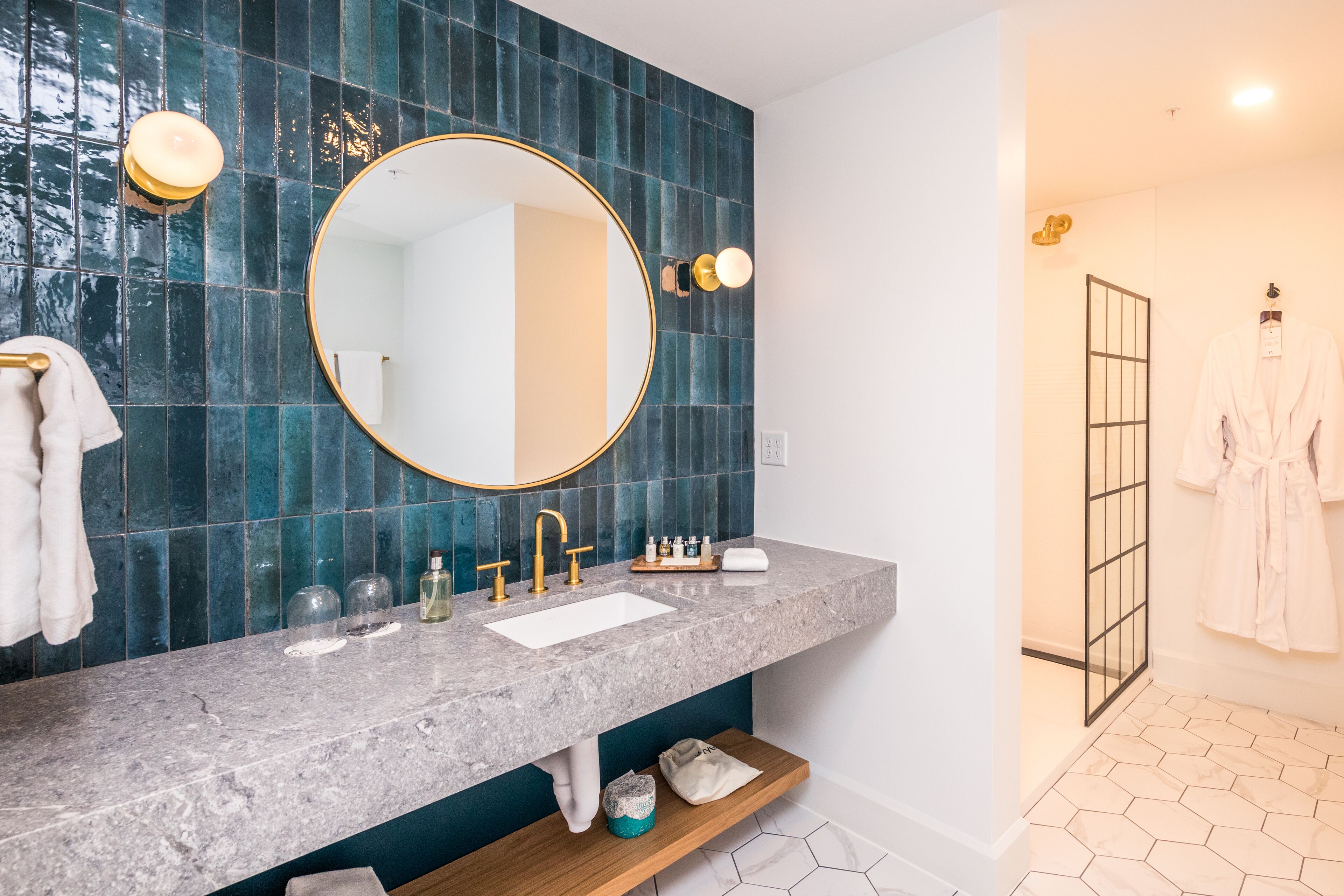 deluxe suite, 1 bedroom | bathroom | designer toiletries, hair dryer, dressing gowns, towels