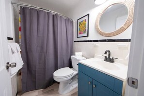 Bathtub, hair dryer, towels