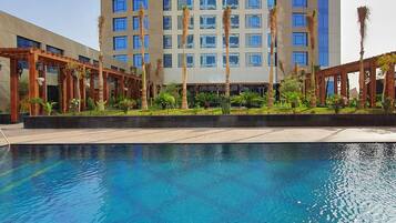 Experience the serene atmosphere of our hotel, surrounded by a beautifully landscaped garden and a sparkling pool.