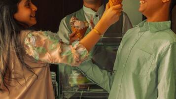 A person holding an ice cream cone.