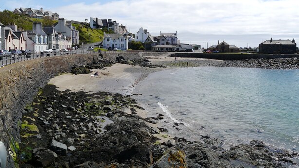 A coastal town with stone walls, a sandy beach, and buildings along the shore. - Annapurna -  a house that sleeps 8 guests  in 4 bedrooms (Portpatrick, Stranraer)