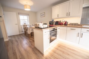 Fridge, microwave, coffee/tea maker, high chair