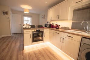 Fridge, microwave, coffee/tea maker, high chair