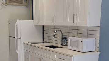 Fridge, microwave, stovetop, coffee/tea maker