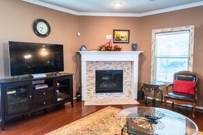 Smart TV, fireplace, books, offices