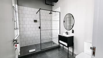 Shower, rainfall showerhead, hair dryer, towels