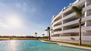 A modern hotel with a pool, palm trees, and a clear sky. - Ref. 346636 (Motril)