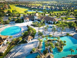 A resort with multiple swimming pools, a golf course, and a large clubhouse. - 2-Story Slide & Disney Magic – The Ultimate Family Adventure Awaits! (Davenport)