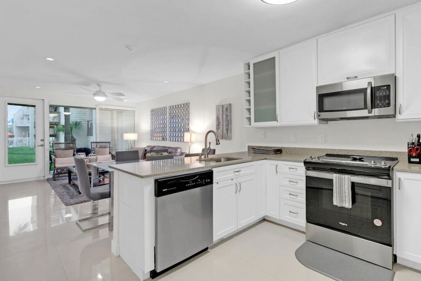 Fridge, microwave, coffee/tea maker, cookware/dishes/utensils