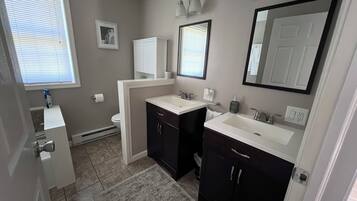 Shower, hair dryer, towels, toilet paper