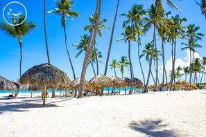 On the beach, sun loungers, beach towels