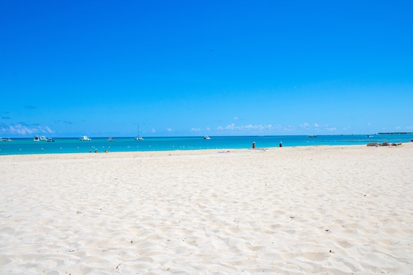 On the beach, sun loungers, beach towels