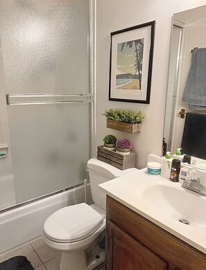 Combined shower/tub, hair dryer, towels, soap