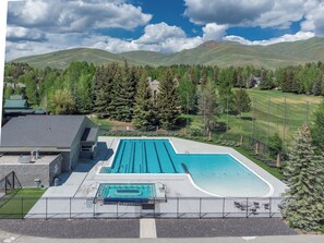 Outdoor pool, a heated pool - Cozy Family sized Condo- access to Hot Tub and Sauna- Minutes away from Skiing (Sun Valley)