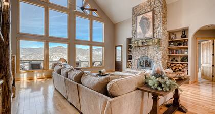 Lodge-style home with striking mountain views, fireplaces, & hot tub