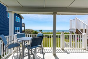 Outdoor dining - "Waters Edge 427-C" - Oceanfront Condo w/ Community Pool, 2 Bedrooms / 2 Bathrooms (Holden Beach)