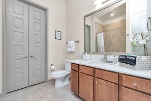 Combined shower/tub, hair dryer, towels, soap