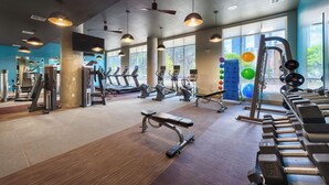 A gym with treadmills, weight machines, and free weights. - Downtown Retreat Near Attractions W\ Free Parking (Houston)