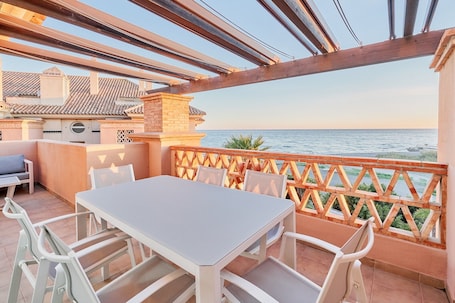 Outdoor dining. Beautiful Penthouse Near the Beach with Sea View, Pool, Wi-Fi, Air Conditioning, Balcony & Terrace