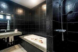 Combined shower/bathtub, hair dryer, towels, soap
