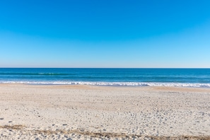 A beach with a clear sky and calm sea. - Over The Moon - 4 BR home, Oceanfront B-Lot with Amazing Views! Dog Friendly! (Surf City)