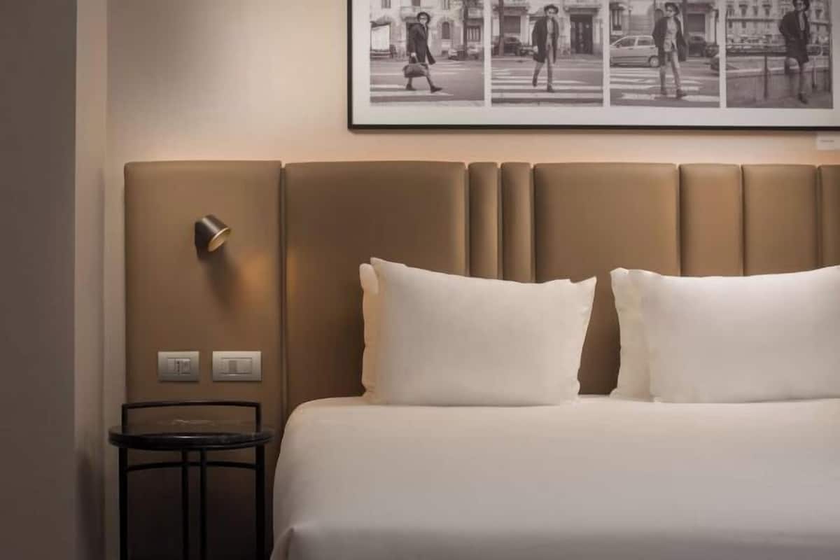 Minibar, desk, laptop workspace, bed sheets