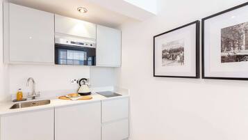 Fridge, microwave, stovetop, cookware/dishes/utensils