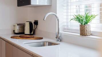 Fridge, microwave, stovetop, cookware/dishes/utensils
