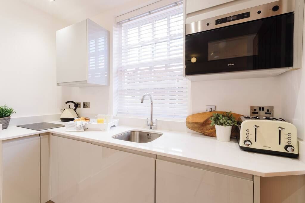 Fridge, microwave, cookware/dishes/utensils