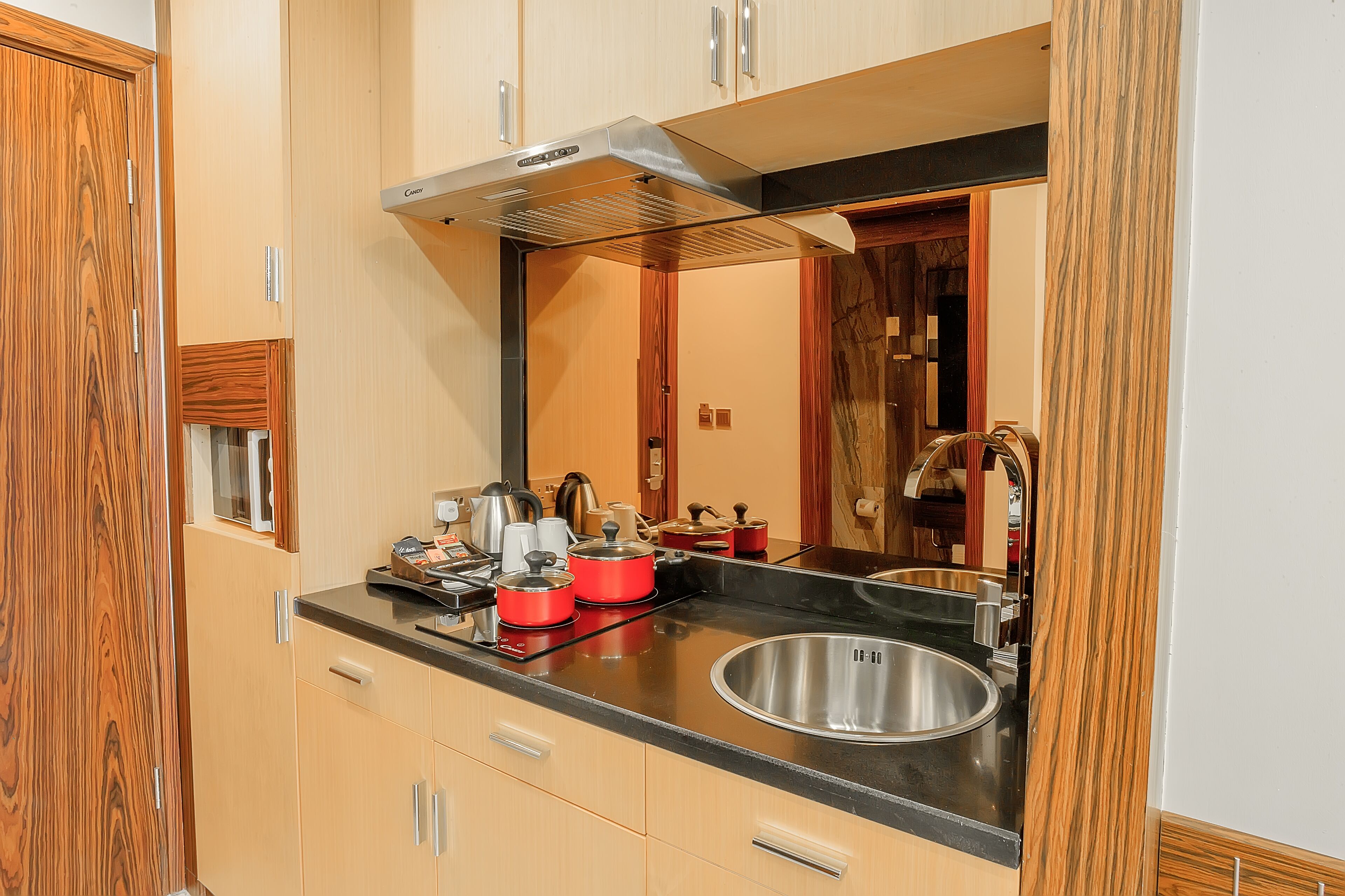 full-sized fridge, microwave, stovetop, electric kettle