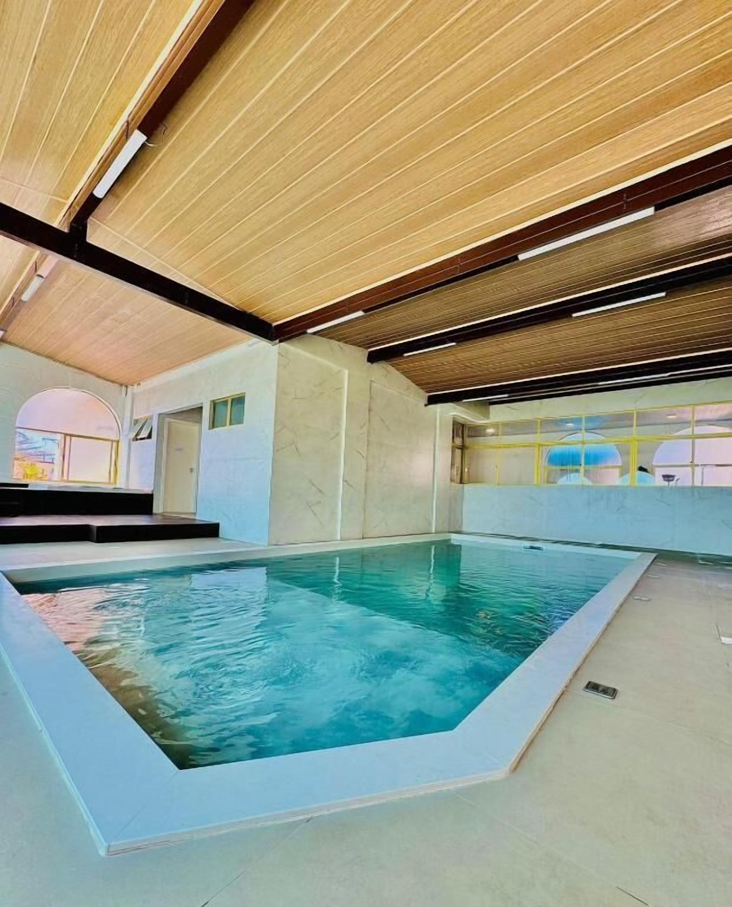 indoor pool, outdoor pool, open 10:00 am to 10:00 pm, pool loungers