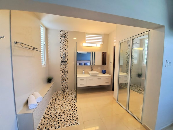 Shower, hair dryer, towels, shampoo