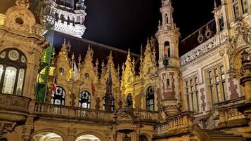 An ornate building with intricate architectural details and a prominent tower.