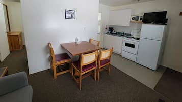 Family Room, 2 Bedrooms | Living area | 25-inch flat-screen TV with cable channels, TV