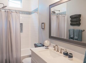 Combined shower/bathtub, hair dryer, towels, soap