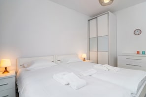 Apartment, 1 Bedroom, Balcony, Garden View | 1 bedroom, cribs/infant beds, bed sheets