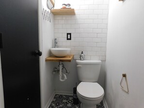 Shower, towels, soap, toilet paper