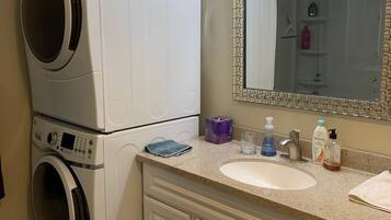 Shower, towels, soap, toilet paper