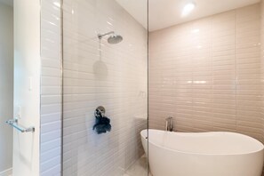 Combined shower/bathtub, towels, soap, toilet paper