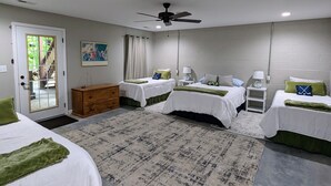 A hotel room with two beds, a wooden dresser, a ceiling fan, and a view of the outdoors. - 5 bdr vacay everyone will LOVE (Loudon)