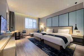 A hotel room with a bed, bedside tables, a desk, a chair, a TV, and a large window with curtains. - Echarm Hotel Wuhan Guanggu Biology City (Wuhan)