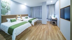 A hotel room with two beds, a desk, a TV, and a large window with curtains. - Greentree Inn Hangzhou Fuyang Wildlife Park Wisdom Hotel (Hangzhou)