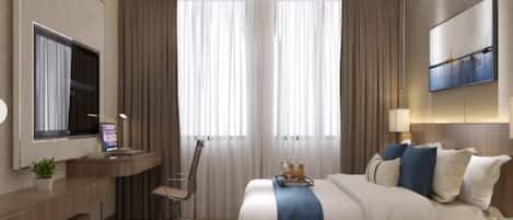 Una habitación de hotel moderna con cama, escritorio, silla y televisor de pantalla plana.