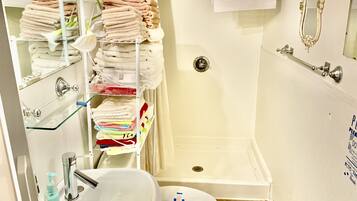 Shower, hair dryer, towels, soap