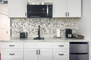 Fridge, microwave, coffee/tea maker, toaster