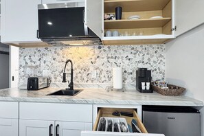 Fridge, microwave, coffee/tea maker, toaster