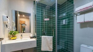 A modern bathroom with a glass-enclosed shower, a white sink, and a towel rack. - Shell Jiangsu Kunshan Development Zone Wusongjiang South Road Hotel (Suzhou)